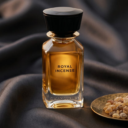Oman Luxury Royal Incense EDP on charcoal raw silk with amber resin pieces near the bottle base