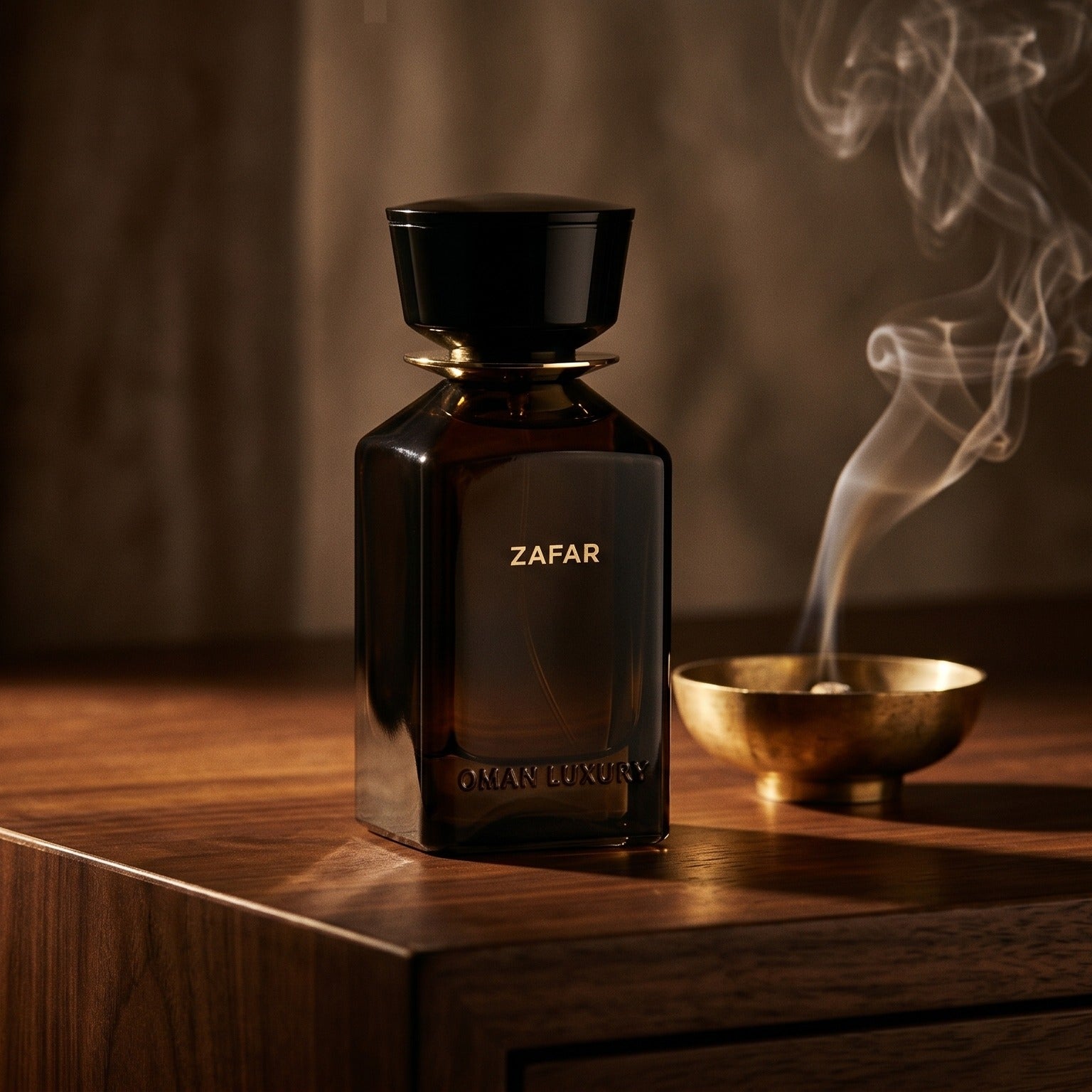 Oman Luxury Zafar EDP on charcoal slate with a slender oud chip and drifting incense smoke