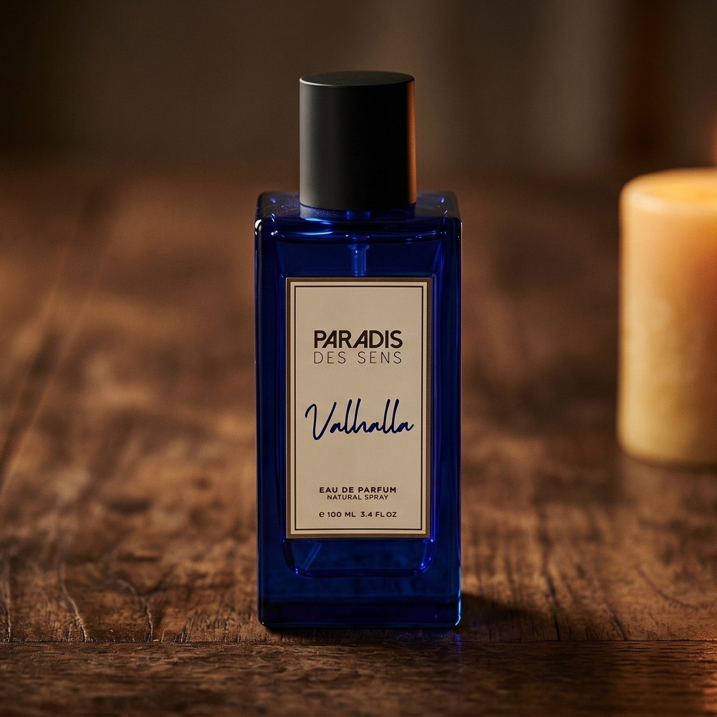 Paradis des Sens Valhalla Eau de Parfume on aged teak with a candle burning gently to frame-right