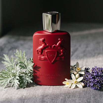 Parfums de Marly Kalan EDP on stone-grey linen with a sprig of wormwood beside lavender and orange blossom