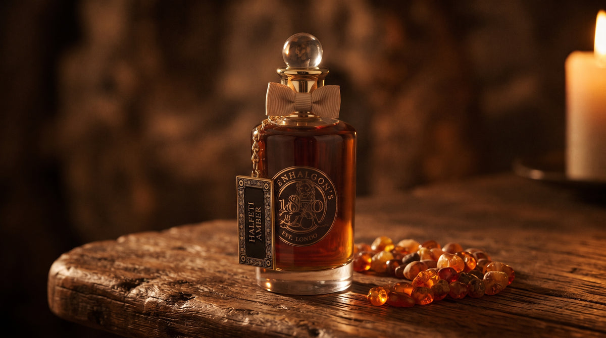 Penhaligon's Halfeti Amber EDP - Dubai Exclusive on aged teak with amber resin beads catching the light to one side