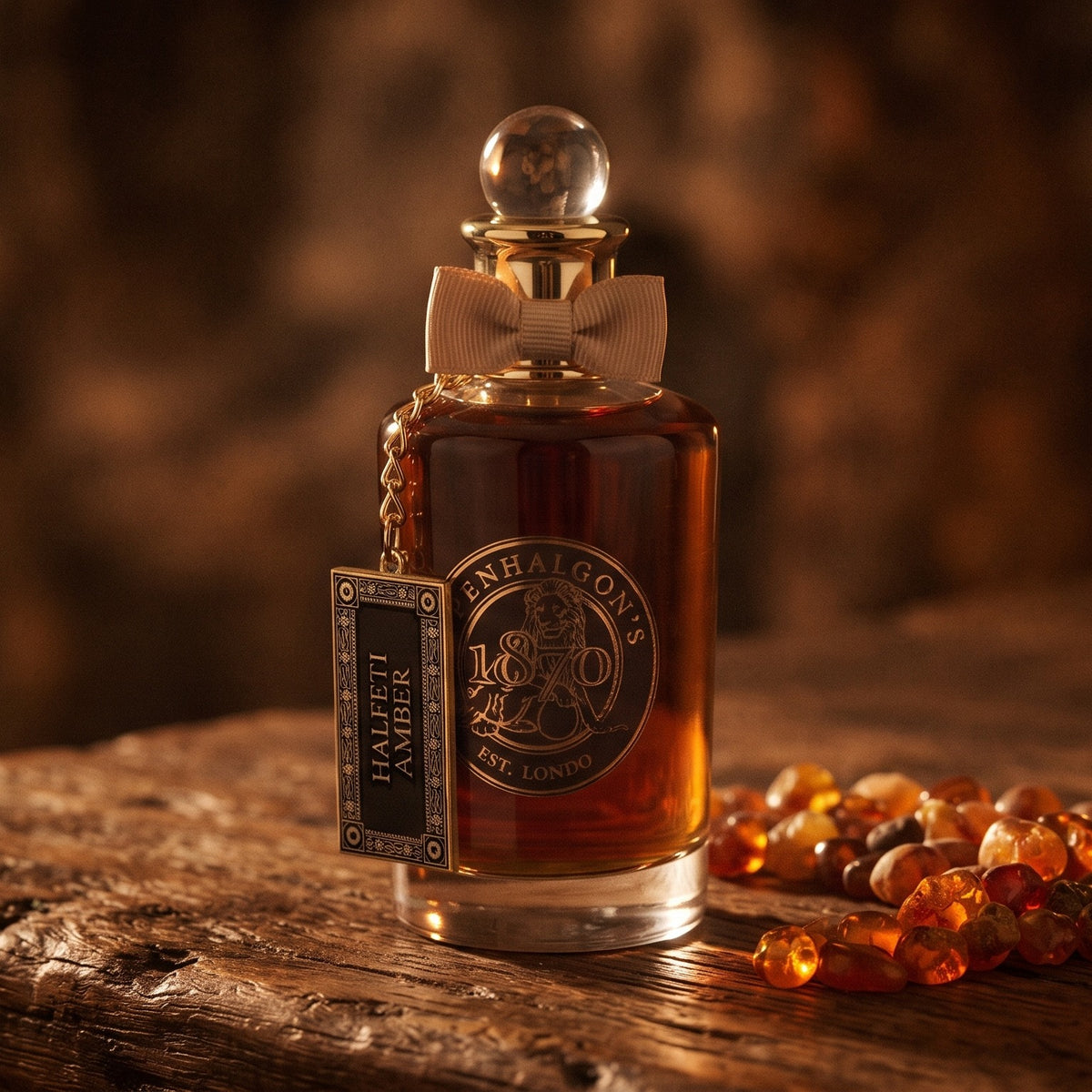 Penhaligon's Halfeti Amber EDP - Dubai Exclusive on aged teak with amber resin beads catching the light to one side