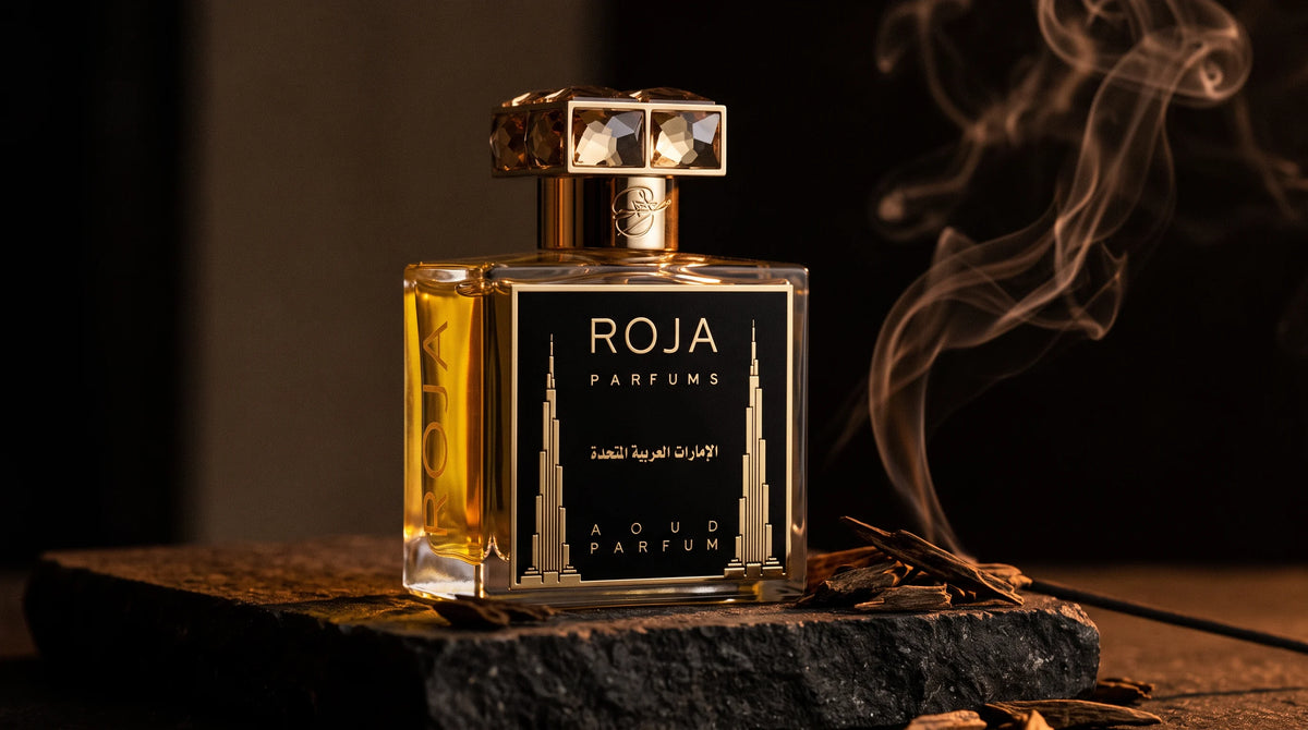 Roja United Arab Emirates Parfum on dark stone with agarwood chips with smoke curling upward