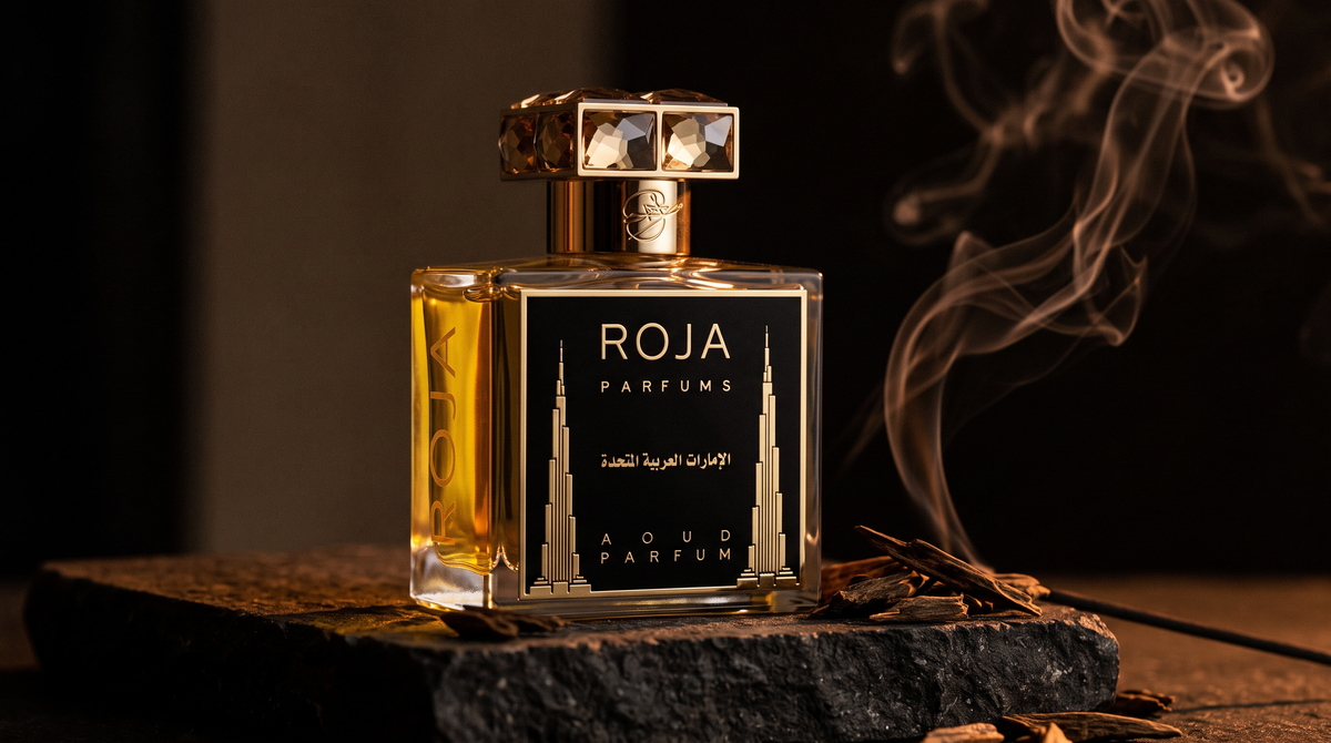 Roja United Arab Emirates Parfum on dark stone with agarwood chips with smoke curling upward