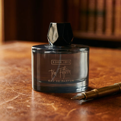 Room 1015 Ten Fifteen EDP on chestnut saddle-leather seat with a pair of leather gloves nearby