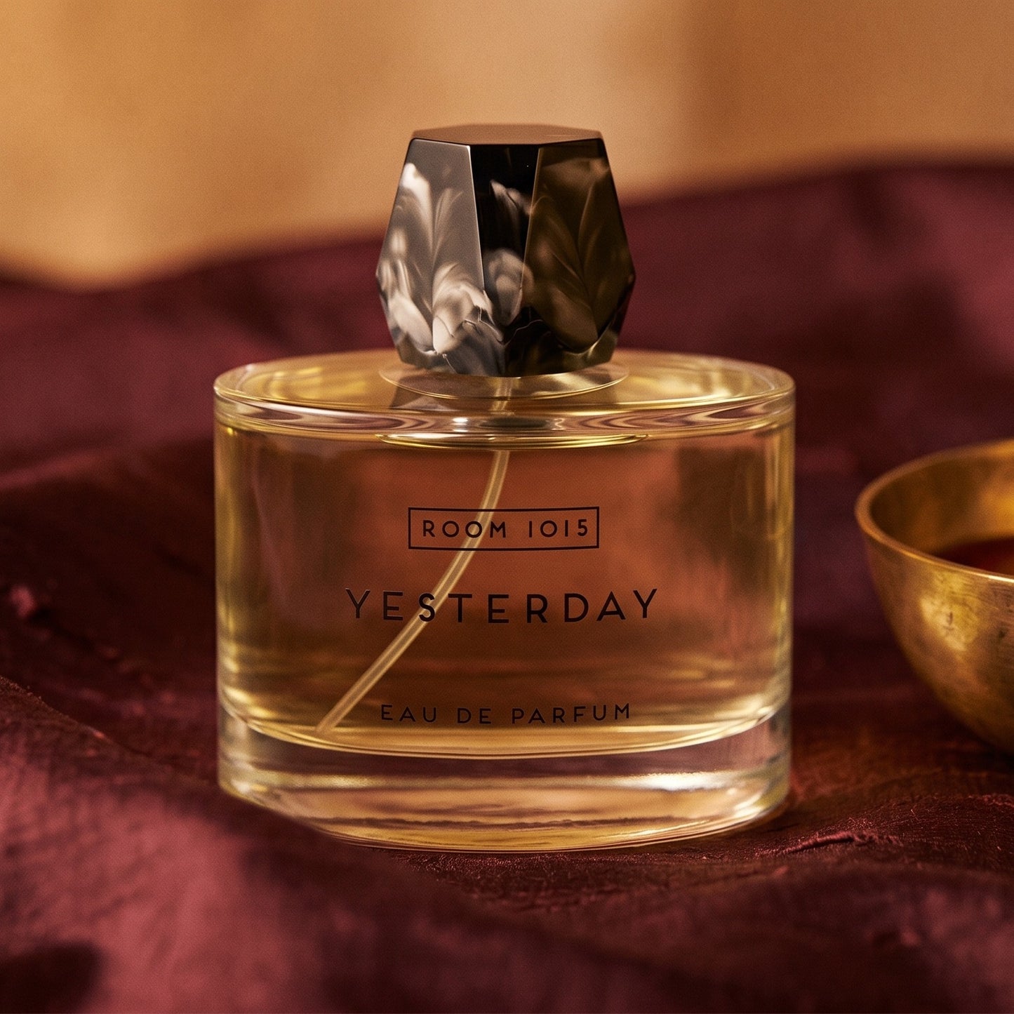 Room 1015 Yesterday EDP on deep caramel velvet with a small copper jar of resin balm