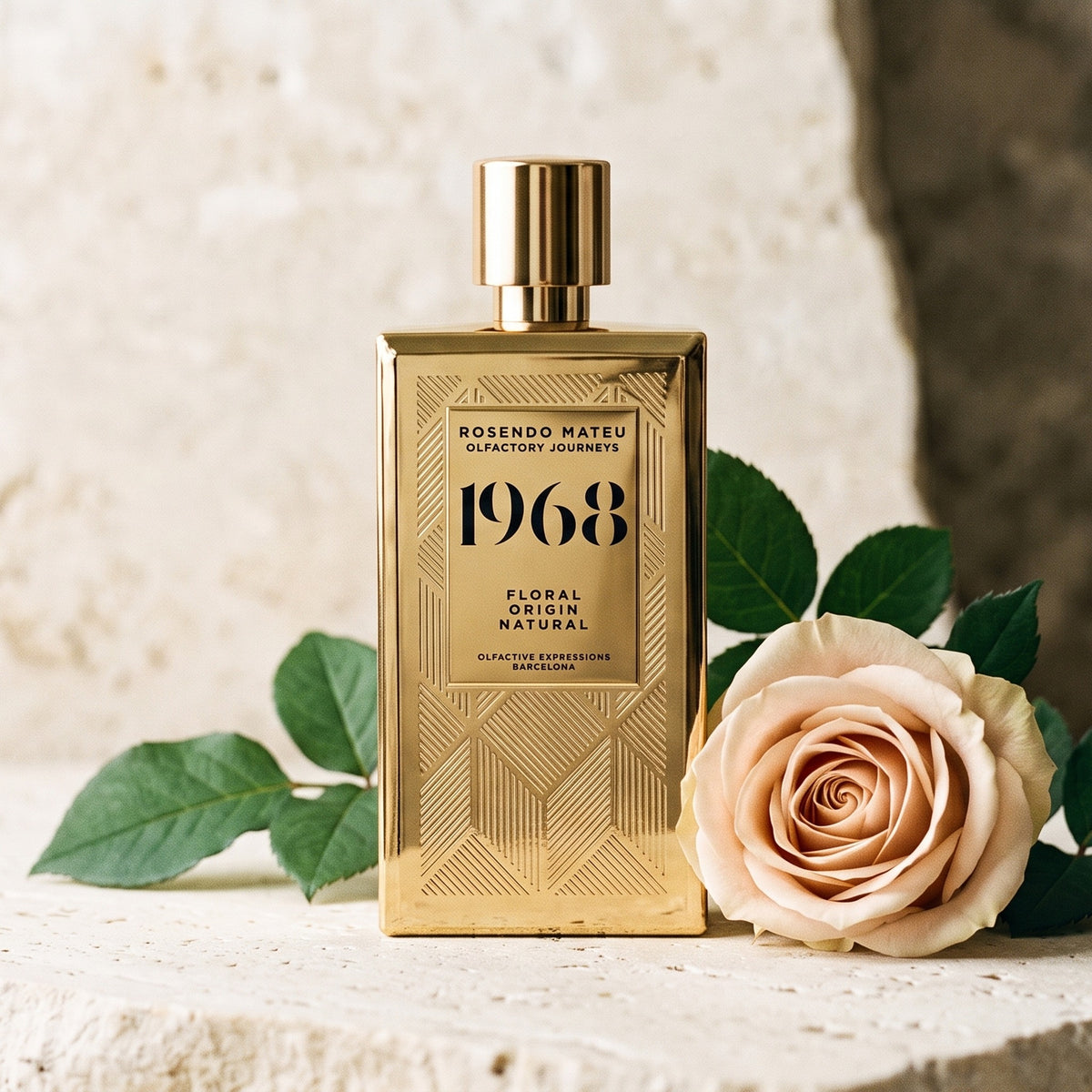 Rosendo Mateu 1968 EDP on pale stone with a single rose beside fresh green leaves