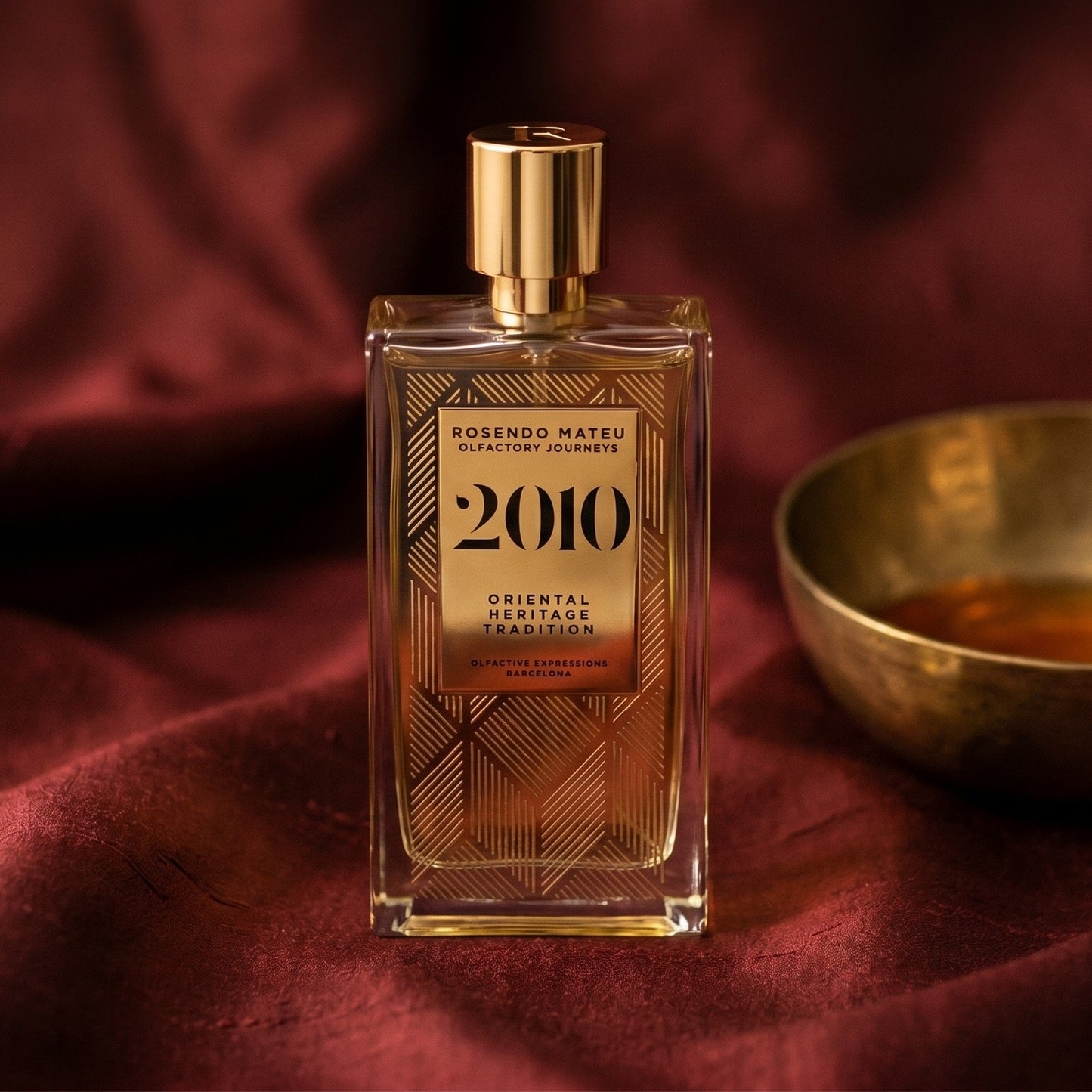 Rosendo Mateu 2010 EDP on cinnamon-tone silk with a shallow saucer of warm benzoin resin