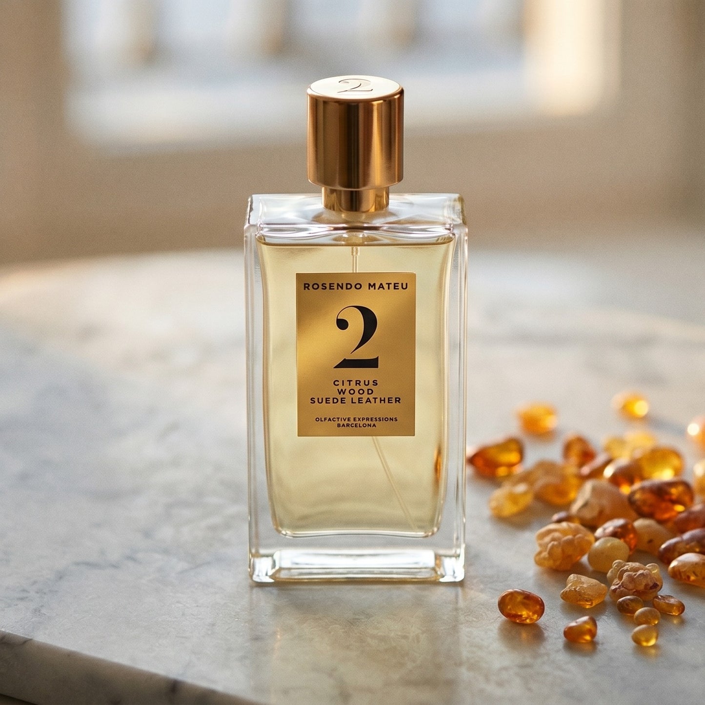 Rosendo Mateu No. 2 EDP on pale sandstone with golden amber shards catching the light
