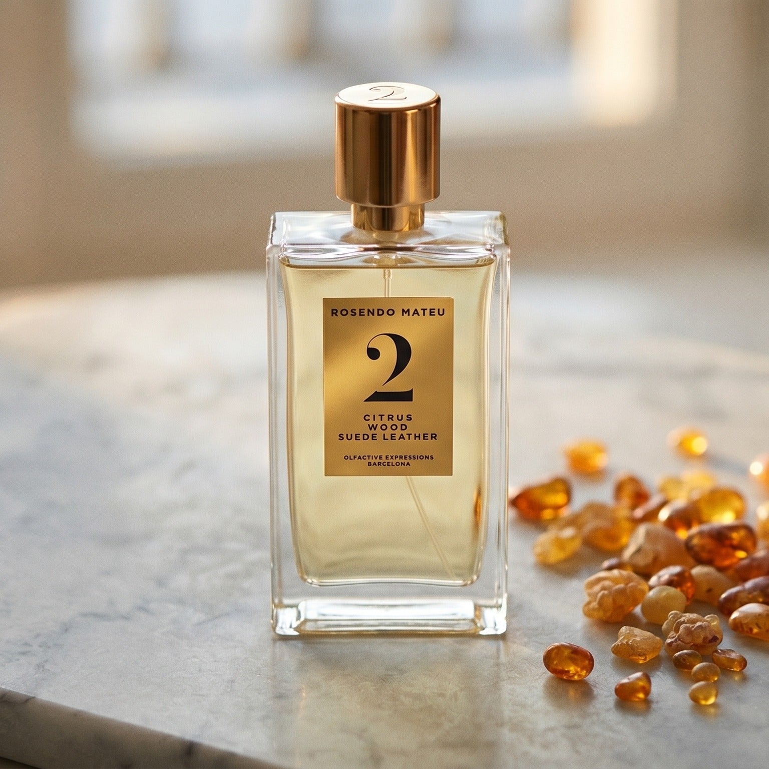 Rosendo Mateu No. 2 EDP on pale sandstone with golden amber shards catching the light