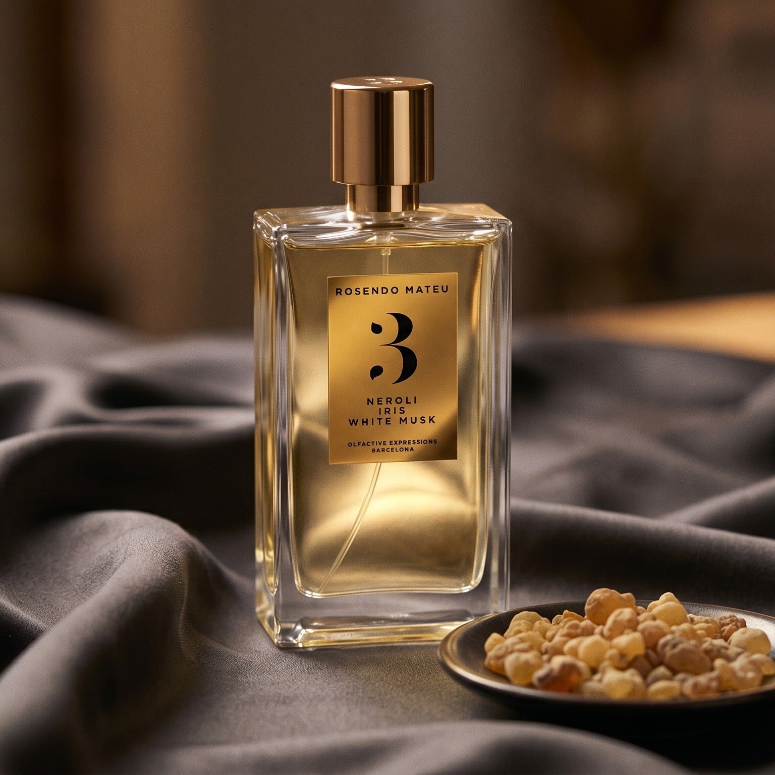Rosendo Mateu No. 3 EDP on deep indigo silk with a tiny copper bowl of myrrh pellets