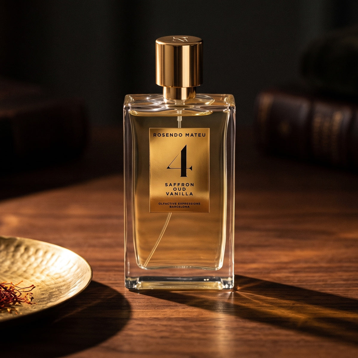 Rosendo Mateu No. 4 EDP on dark walnut console with saffron threads in a small brass dish