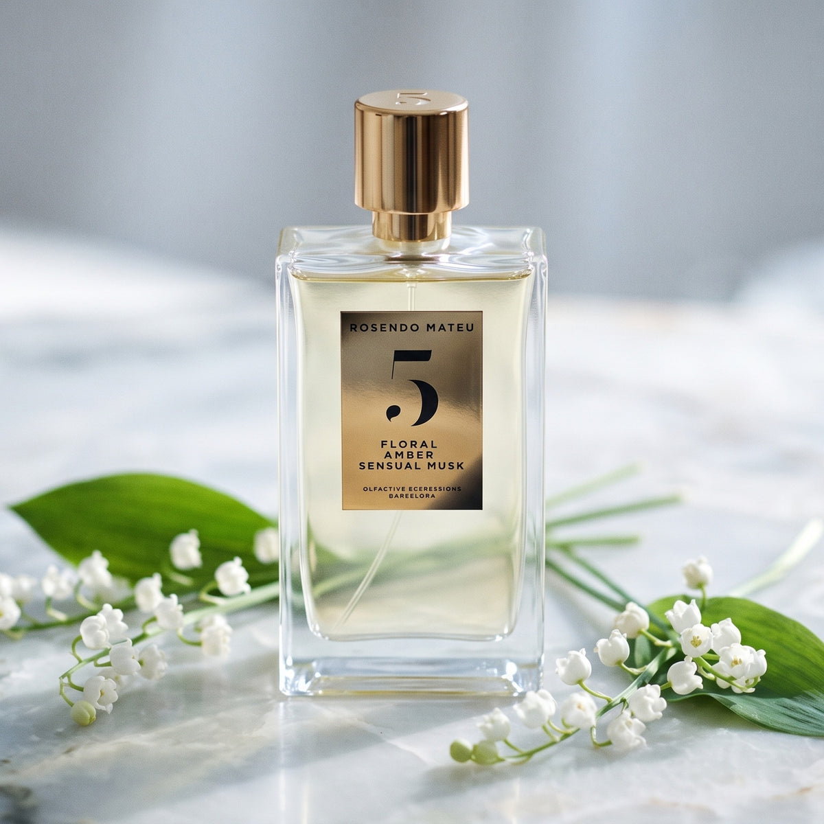 Rosendo Mateu No. 5 EDP on alabaster surface with a few sprigs of lily of the valley