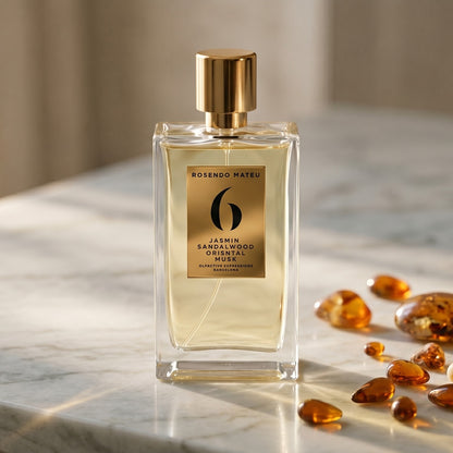 Rosendo Mateu No. 6 EDP on pale sandstone with golden amber shards catching the light