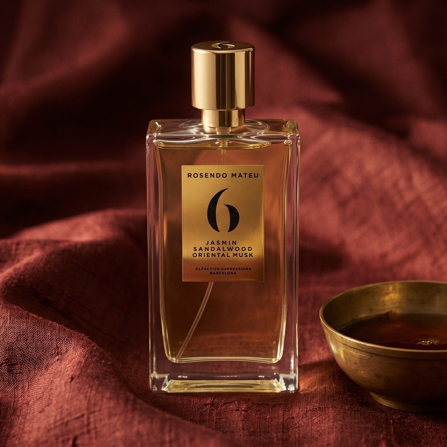 Rosendo Mateu No. 6 EDP on cinnamon-tone silk with a shallow saucer of warm benzoin resin