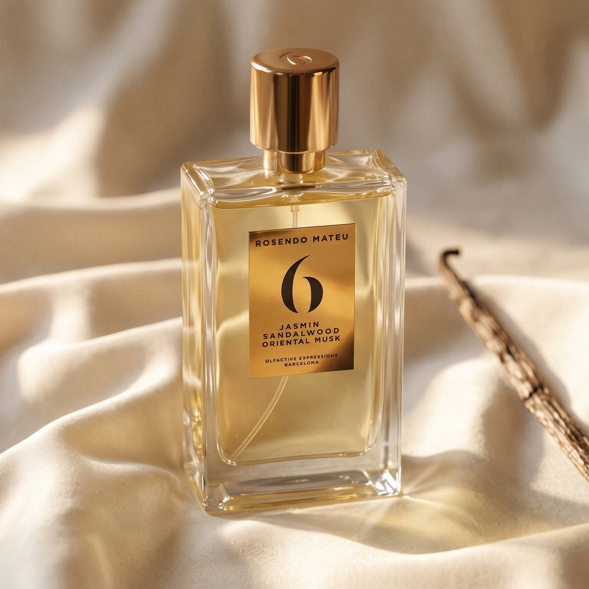 Rosendo Mateu No. 6 EDP on cream silk with a single vanilla pod