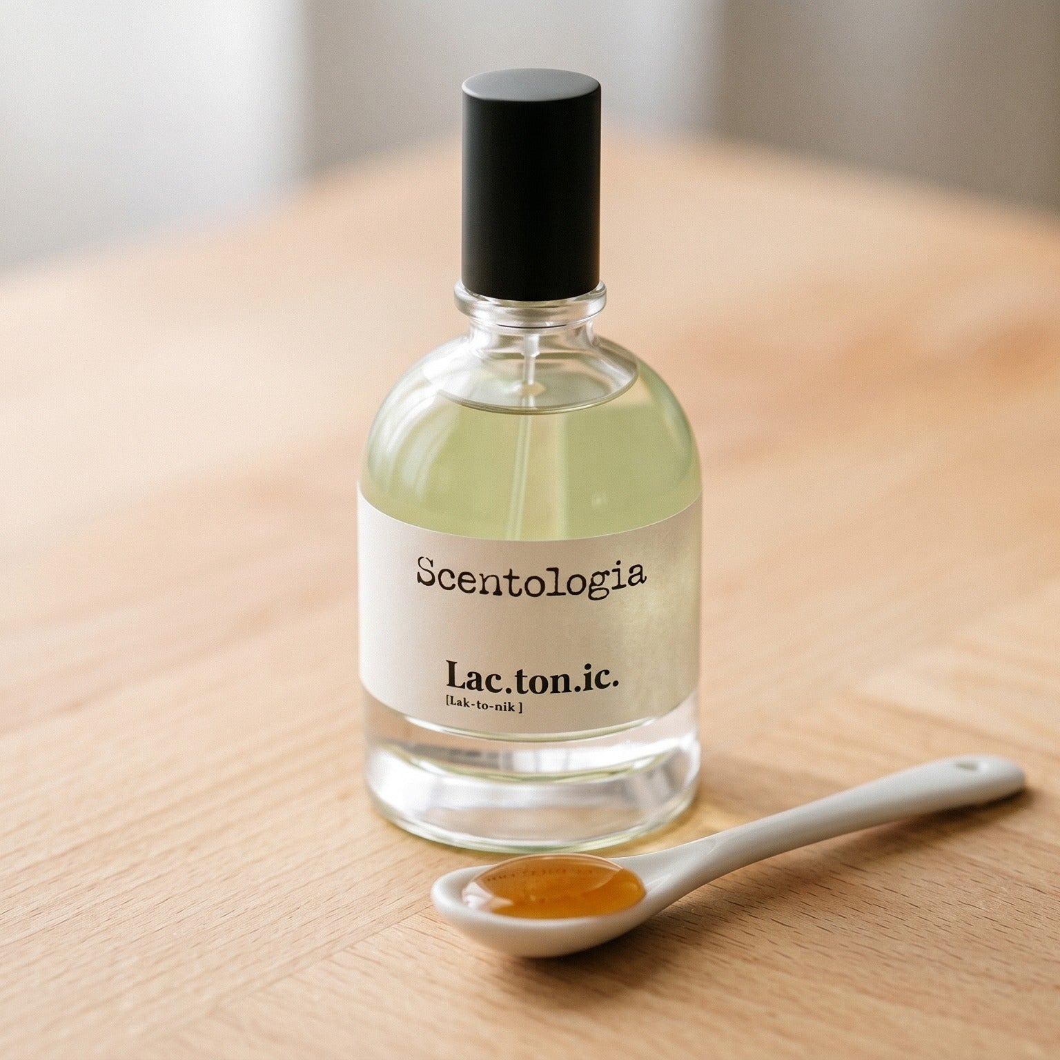 Scentologia Lactonic EDP on birch surface with a glass jar of demerara sugar