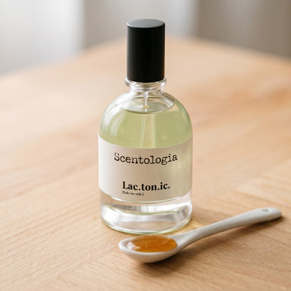 Scentologia Lactonic EDP on birch surface with a glass jar of demerara sugar