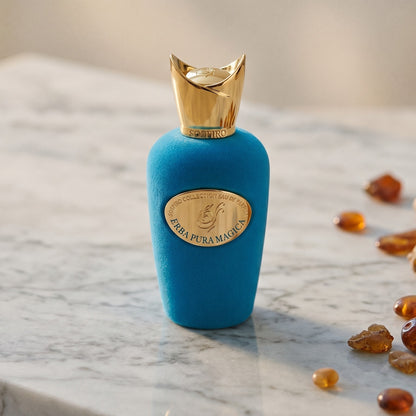 Sospiro Erba Pura Magica on warm ivory travertine with labdanum chunks clustered by the base