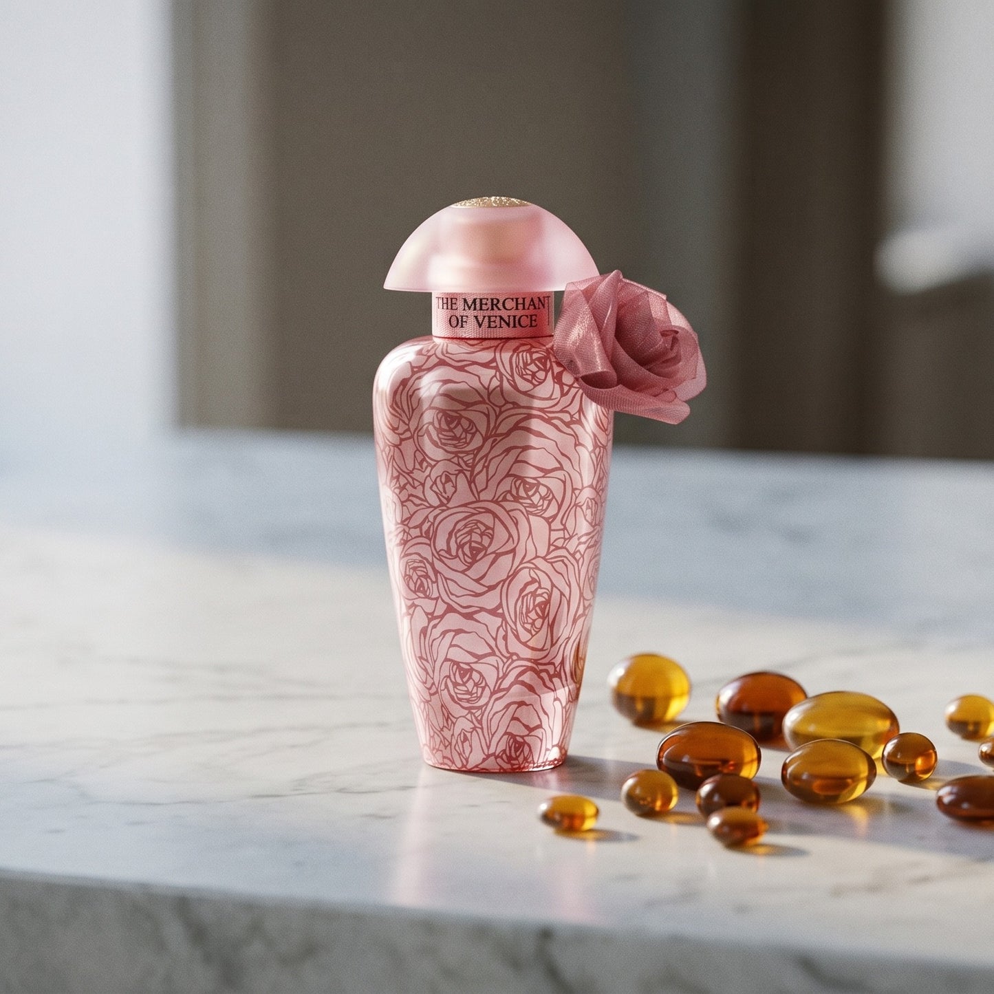 The Merchant of Venice La Fenice Rosa Monceniga Elixir EDP on cream stone with a scatter of honey-colored ambergris flakes