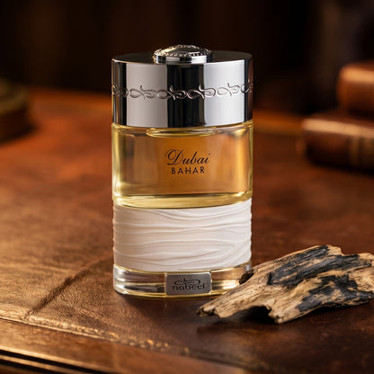 The Spirit of Dubai Bahar on patinated leather tray with a pinch of frankincense beside the bottle