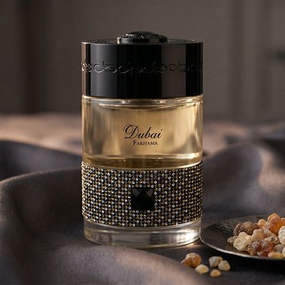 The Spirit of Dubai Fakhama EDP on black velvet with a thread of smoking oud between folds