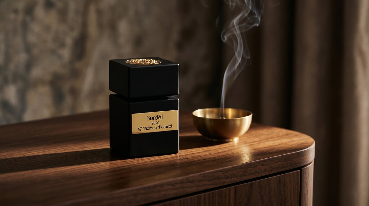Tiziana Terenzi Burdel EDP on dark walnut console with a small brass incense bowl with smoke curling upward