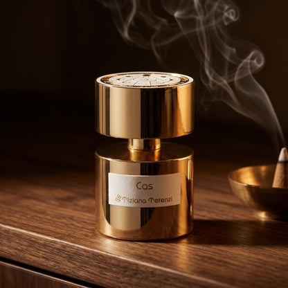 Tiziana Terenzi Cas de Parfum on smoked-glass tabletop with a lacquered incense burner in mid-glow