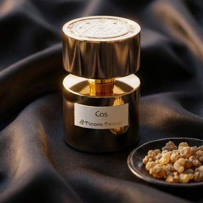 Tiziana Terenzi Cas de Parfum on deep indigo silk with a tiny copper bowl of myrrh pellets