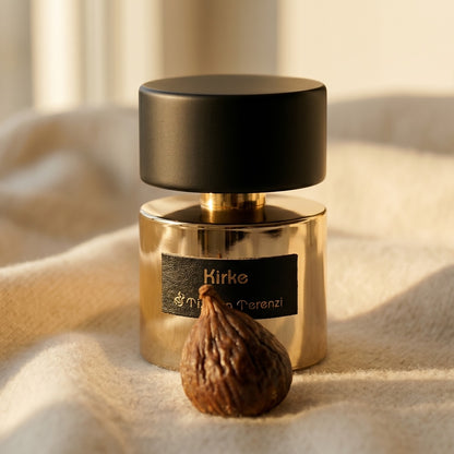 Tiziana Terenzi Kirke EDP on ivory cashmere with a small cluster of spiced walnuts