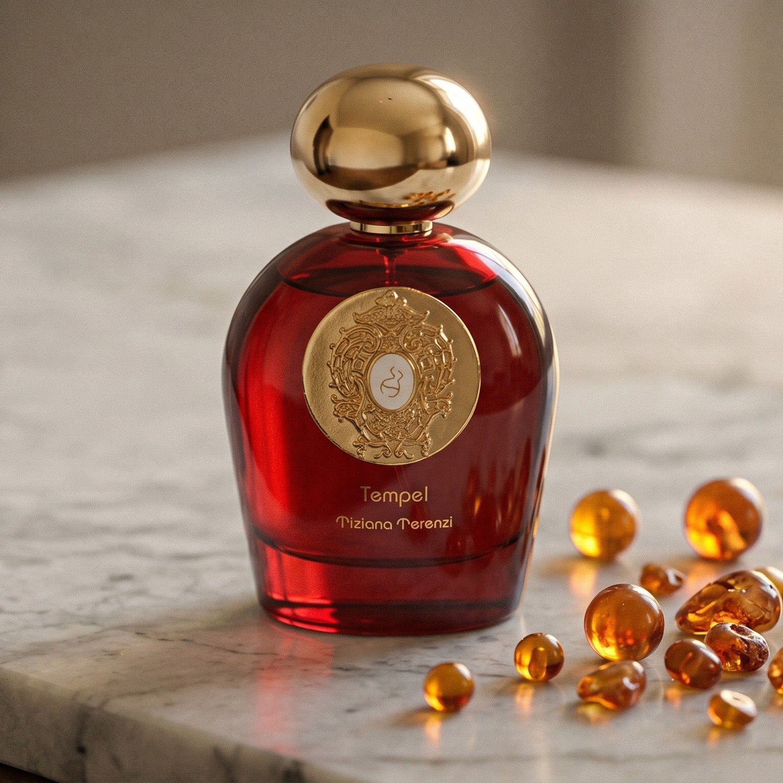 Tiziana Terenzi Tempel Comete EDP on pale sandstone with golden amber shards catching the light