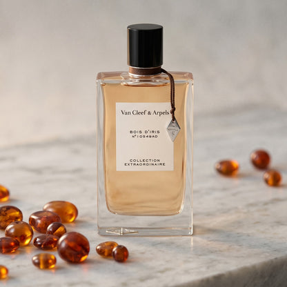 Van Cleef Bois Diris EDP on polished limestone with benzoin resin pebbles arranged loosely