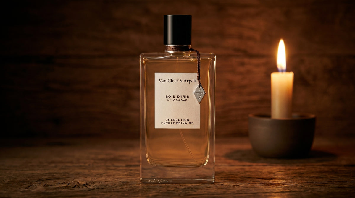 Van Cleef Bois Diris EDP on aged teak with a candle burning gently to frame-right
