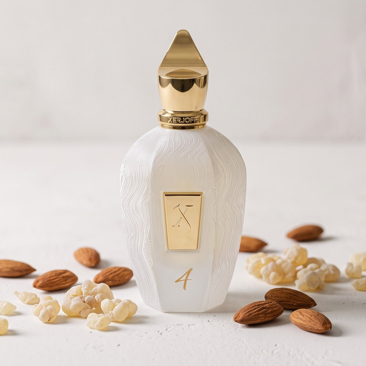 Xerjoff 4 Four White Eau de Parfum - UAE Exclusive Dubai Boutique Edition on smooth white plaster with almonds and olibanum tears