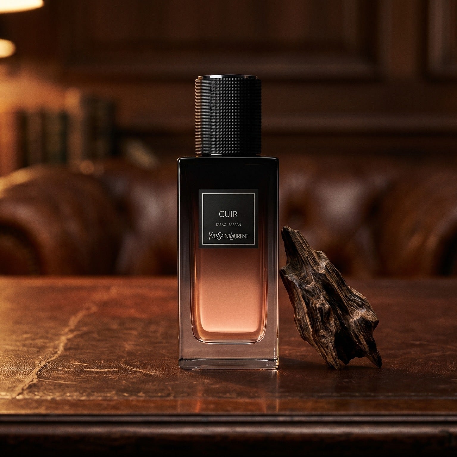 Yves Saint Laurent Cuir on patinated leather tray with a pinch of frankincense beside the bottle