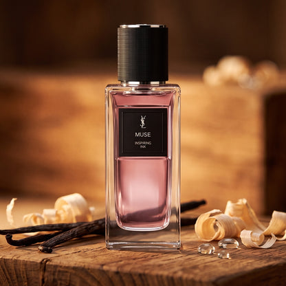 Yves Saint Laurent Muse Inspiring Ink EDP on aged teak with vanilla pods and pale wood shavings