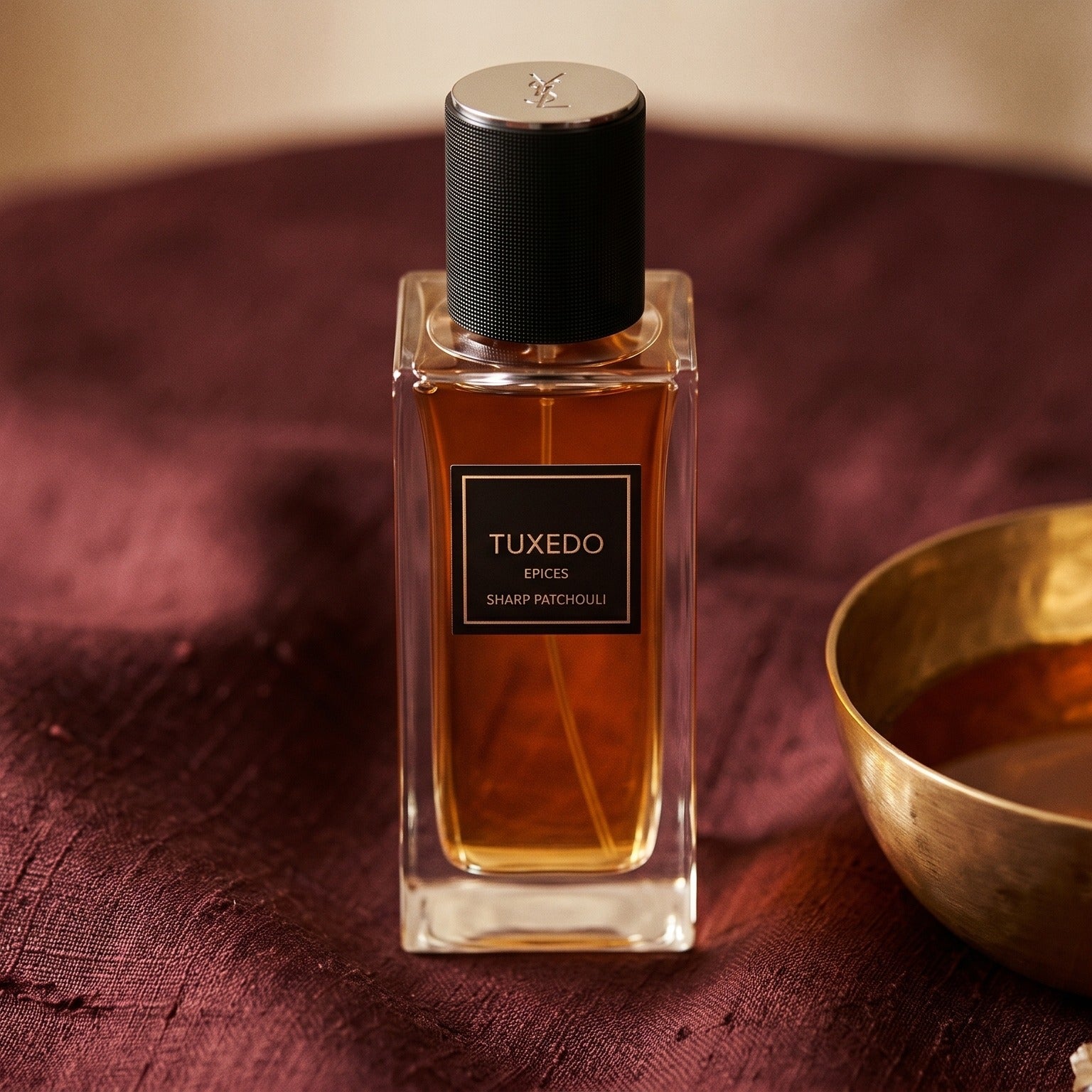 Yves Saint Laurent Tuxedo Epices Sharp Patchouli EDP on cinnamon-tone silk with a shallow saucer of warm benzoin resin