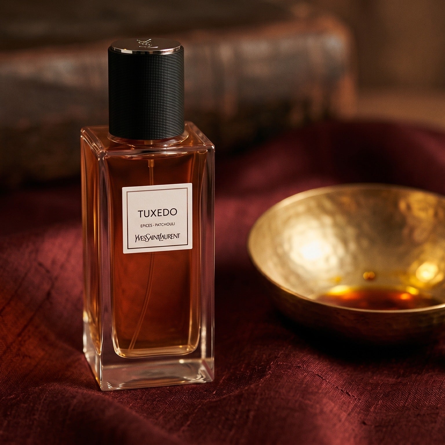 Yves Saint Laurent Tuxedo on burnt-orange raw silk with a brass vial of frankincense oil